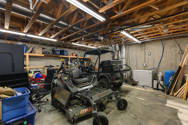 garage with refrigerator and a garage door opener