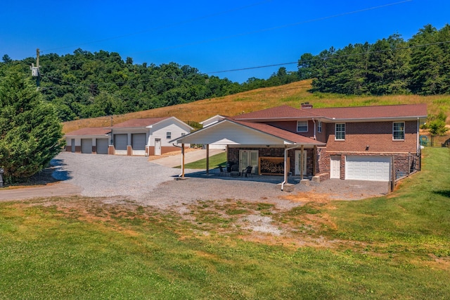 rear view of property with a yard