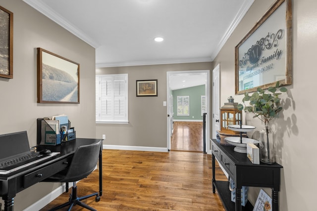 office space with hardwood / wood-style flooring and crown molding