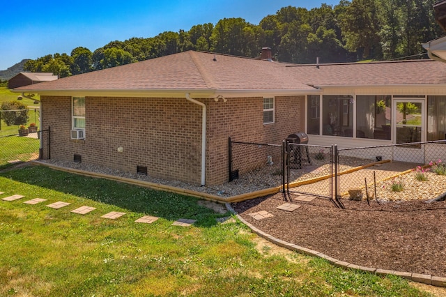 back of property with a yard and cooling unit