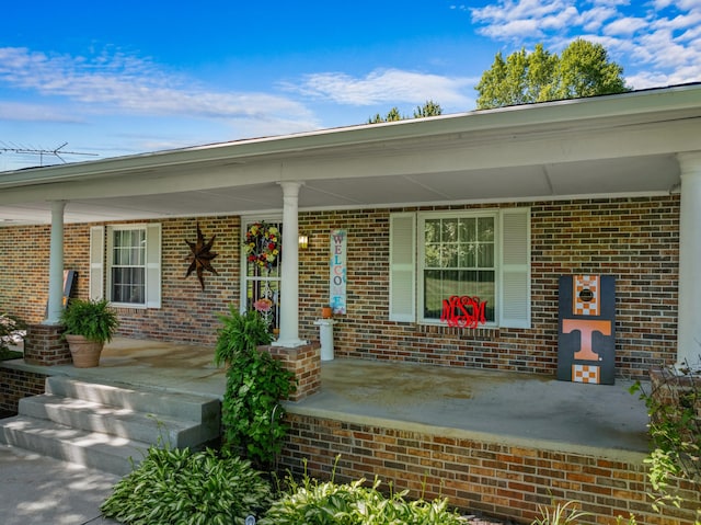 doorway to property featuring covered porch