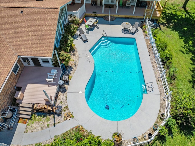 view of swimming pool featuring a deck