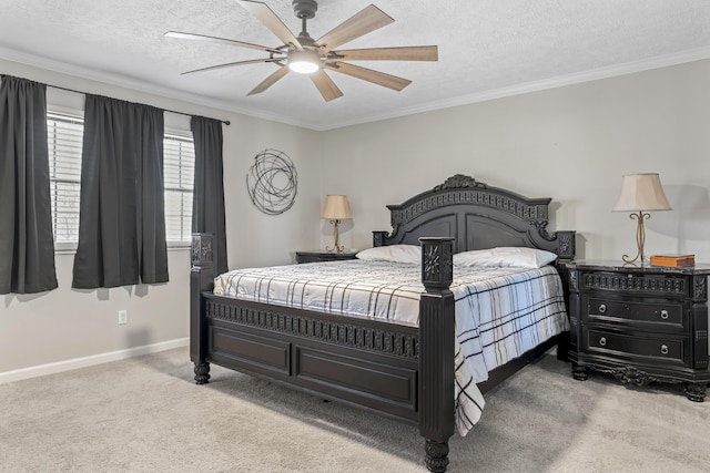 carpeted bedroom featuring a textured ceiling, ornamental molding, a ceiling fan, and baseboards