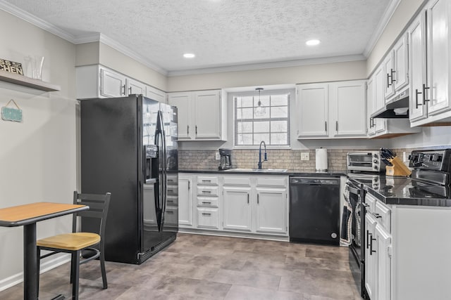 kitchen featuring dark countertops, a sink, under cabinet range hood, and black appliances