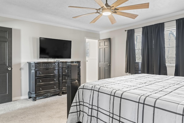 bedroom featuring carpet, crown molding, ceiling fan, a textured ceiling, and baseboards