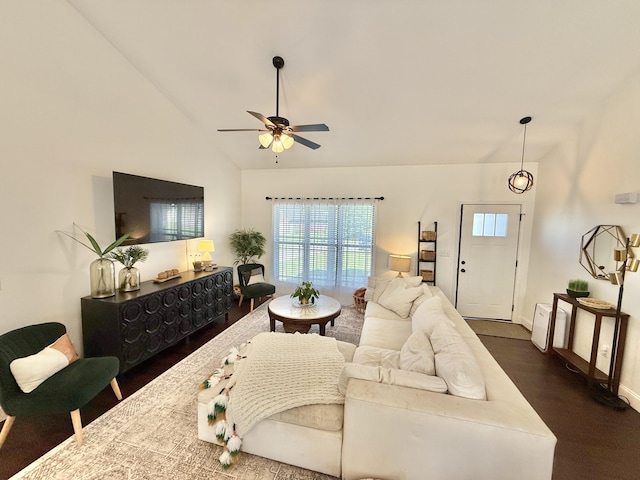 living area with a ceiling fan, dark wood-style flooring, baseboards, and high vaulted ceiling