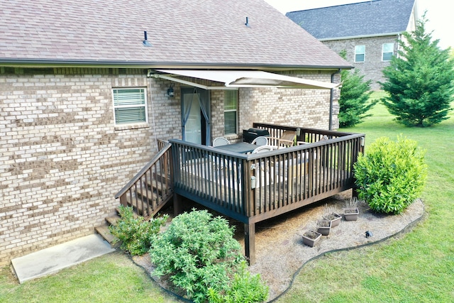 wooden terrace with a lawn