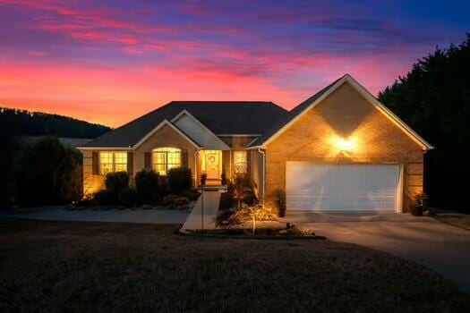 784 Constitution Dr, Jefferson City, TN 37760 - ranch-style house with an attached garage and concrete driveway