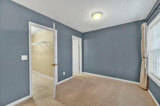 784 Constitution Dr, Jefferson City, TN 37760 - unfurnished bedroom with carpet floors, multiple windows, and baseboards