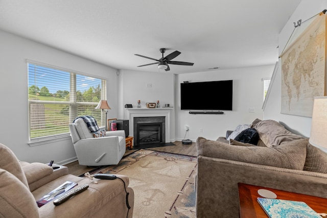 1065 Greenway Dr, Morristown, TN 37813 - living room with baseboards, wood finished floors, a ceiling fan, and a fireplace with flush hearth