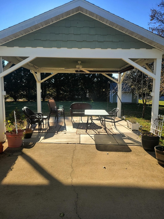 view of patio / terrace featuring a gazebo and a shed