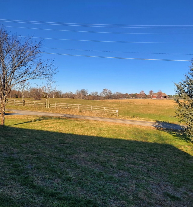 view of yard with a rural view