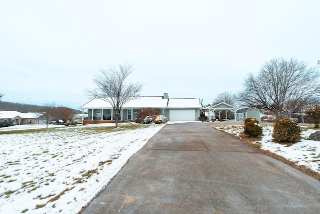 ranch-style house featuring a garage