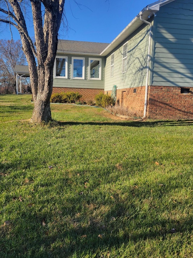 view of property exterior with a lawn