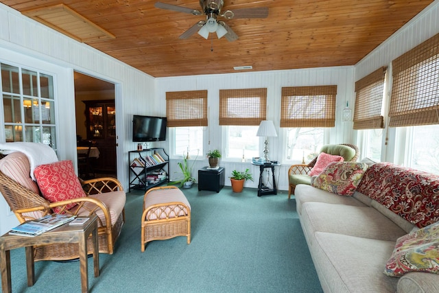 living room with wooden ceiling, ceiling fan, and carpet flooring