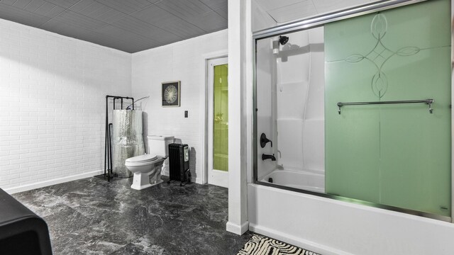 261 Buzzard Roost Rd, Bulls Gap, TN 37711 - bathroom featuring toilet, baseboards, and shower / bath combination with glass door