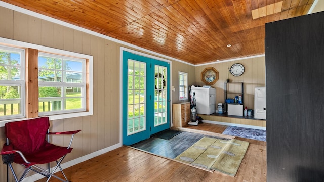 261 Buzzard Roost Rd, Bulls Gap, TN 37711 - foyer entrance with washer / dryer, wood ceiling, crown molding, hardwood / wood-style floors, and wooden walls