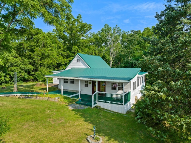 261 Buzzard Roost Rd, Bulls Gap, TN 37711 - view of front of property featuring a front yard, metal roof, and covered porch