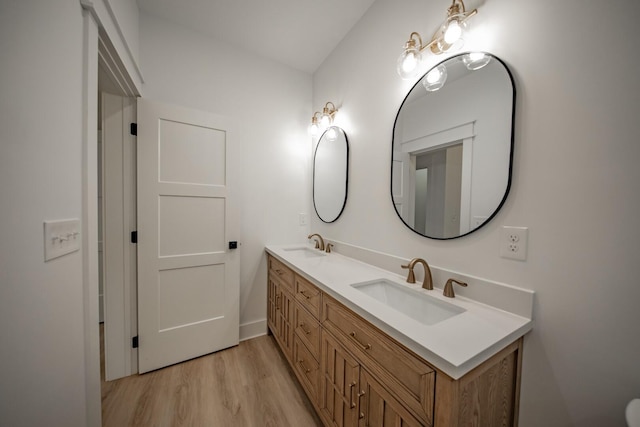 1056 Old Newport Hwy, Dandridge, TN 37725 - bathroom featuring double vanity and wood finished floors