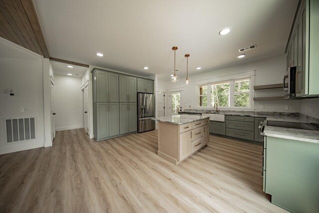 1056 Old Newport Hwy, Dandridge, TN 37725 - kitchen featuring stainless steel appliances, recessed lighting, a center island, light wood-style flooring, and light stone counters