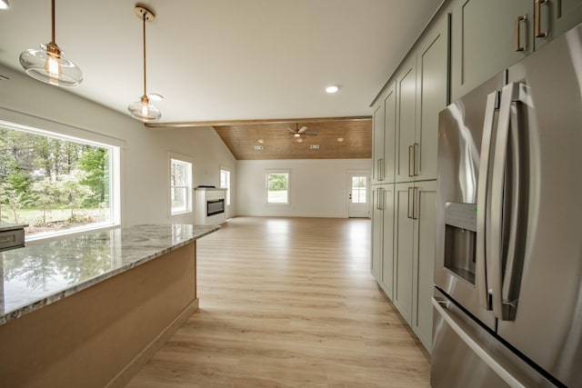 1056 Old Newport Hwy, Dandridge, TN 37725 - kitchen featuring stainless steel fridge, light wood-style flooring, recessed lighting, lofted ceiling, and light stone countertops