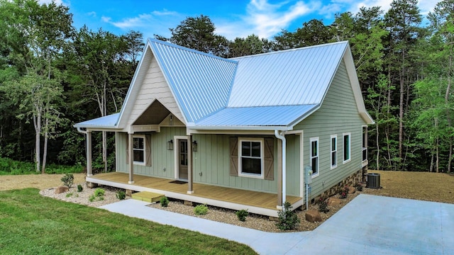 1056 Old Newport Hwy, Dandridge, TN 37725 - view of front of home with a metal roof, a front lawn, and board and batten siding