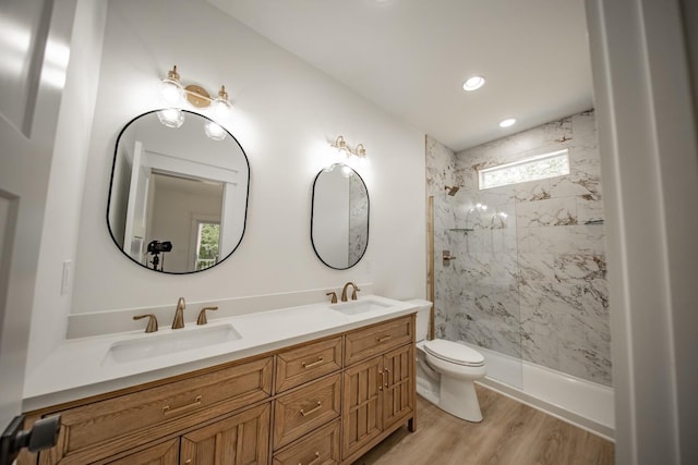 1056 Old Newport Hwy, Dandridge, TN 37725 - bathroom with double vanity, a tile shower, wood finished floors, and recessed lighting