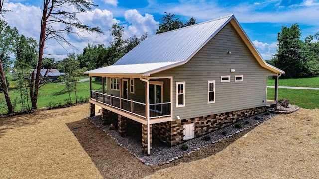1056 Old Newport Hwy, Dandridge, TN 37725 - view of property exterior with a metal roof and a lawn