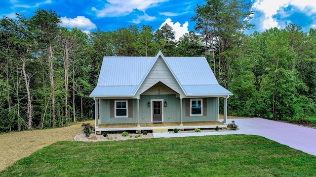 1056 Old Newport Hwy, Dandridge, TN 37725 - view of front of property with covered porch, a front lawn, a metal roof, and driveway