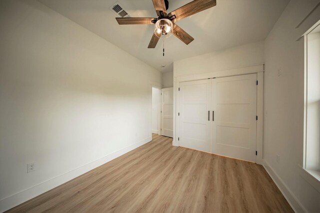 1056 Old Newport Hwy, Dandridge, TN 37725 - unfurnished bedroom featuring light wood-style floors, a closet, and a ceiling fan