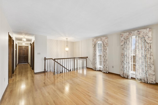 spare room with light wood-type flooring