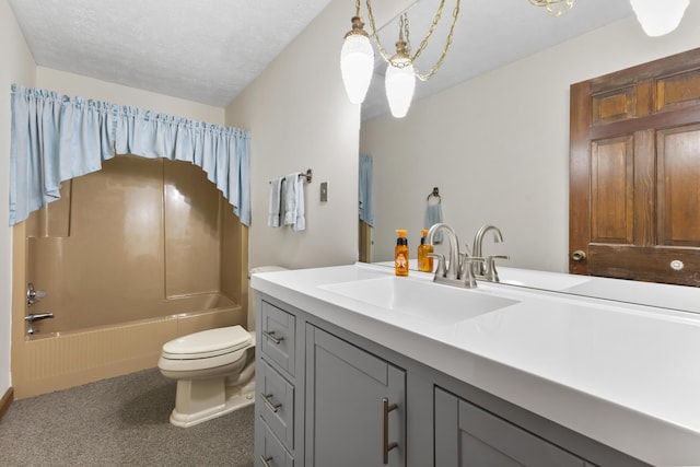 full bathroom featuring a textured ceiling, vanity,  shower combination, and toilet