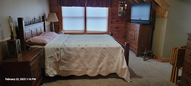 bedroom with light carpet and baseboards