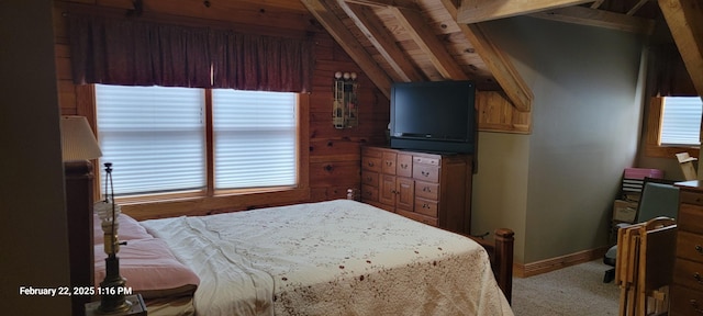 bedroom with vaulted ceiling, light carpet, and baseboards