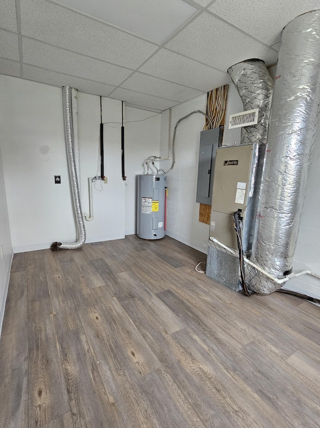 utility room featuring electric panel and electric water heater