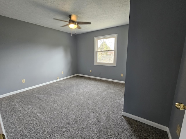 unfurnished room with dark colored carpet, a textured ceiling, and ceiling fan