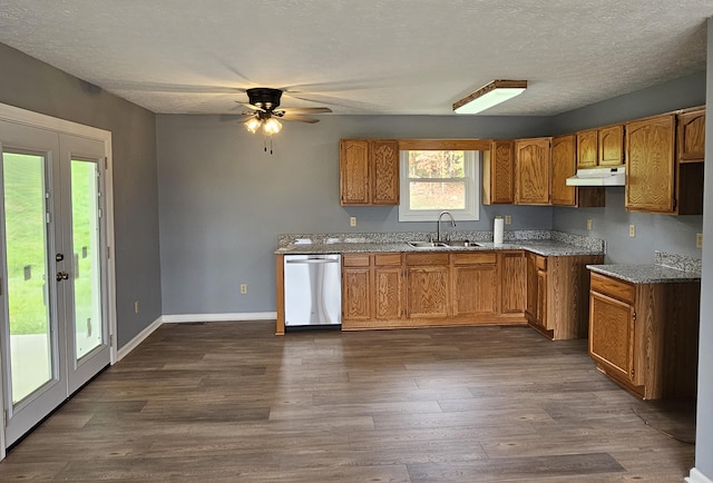 kitchen with french doors, a textured ceiling, dark wood-type flooring, sink, and dishwasher