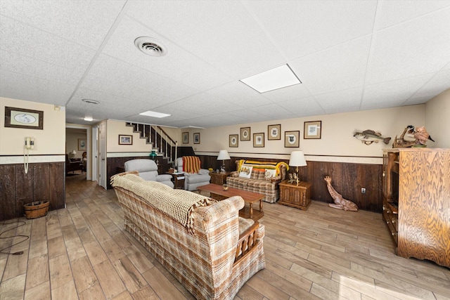 1869 Universal Rd, New Market, TN 37820 - living room with a paneled ceiling, a wainscoted wall, light wood finished floors, and stairway