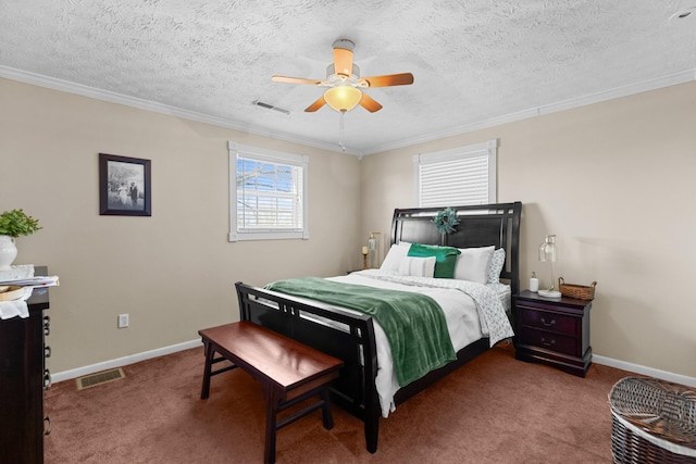 bedroom with ornamental molding, carpet, visible vents, and baseboards