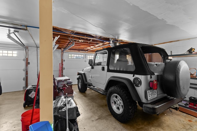 garage with concrete block wall