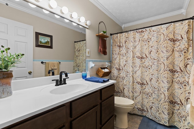 full bathroom featuring toilet, tile patterned floors, crown molding, vanity, and a textured ceiling