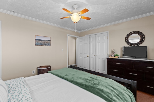 bedroom featuring a ceiling fan, a closet, crown molding, and a textured ceiling