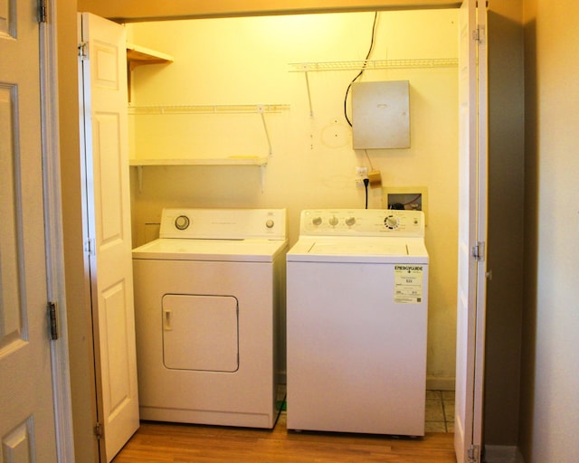 2131 Ted Moore Rd, Dandridge, TN 37725 - laundry room featuring independent washer and dryer and light wood-type flooring