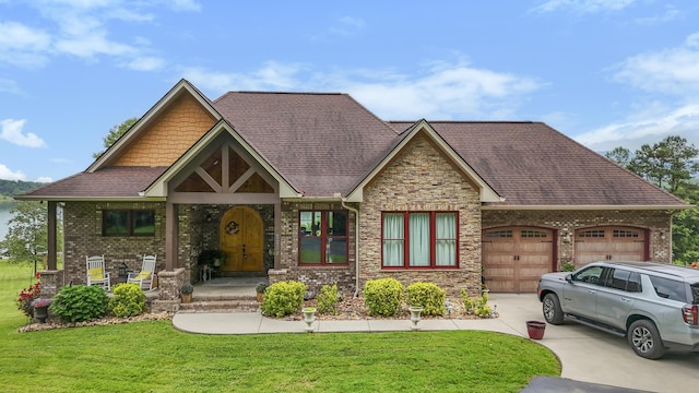 2224 Ted Moore Rd, Dandridge, TN 37725 - view of front of house featuring an attached garage, a front lawn, driveway, and brick siding