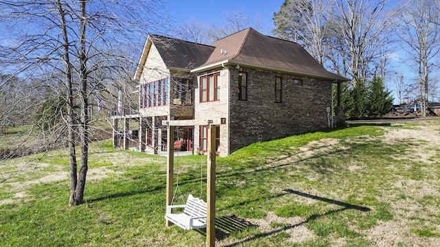 2224 Ted Moore Rd, Dandridge, TN 37725 - view of home's exterior featuring brick siding, a lawn, a wooden deck, and a shingled roof