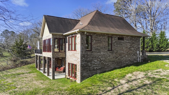 2224 Ted Moore Rd, Dandridge, TN 37725 - view of side of home with brick siding, a patio, a yard, and a shingled roof