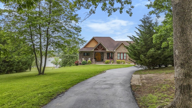 2224 Ted Moore Rd, Dandridge, TN 37725 - view of front facade featuring a front yard, stone siding, asphalt driveway, and brick siding