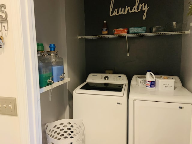 laundry room with washing machine and dryer