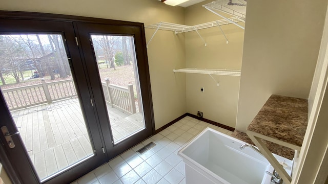 doorway to outside featuring visible vents and baseboards