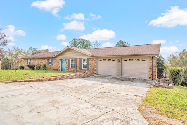 ranch-style house with a garage and a front yard